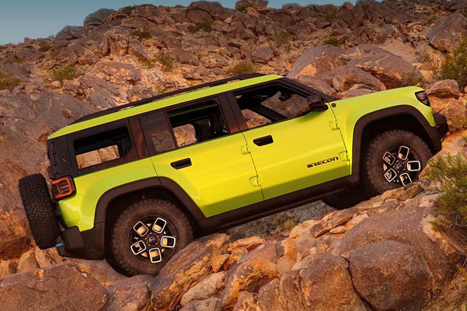 The all-electric 2025 Jeep Recon is climbing a steep, mountainous hill.